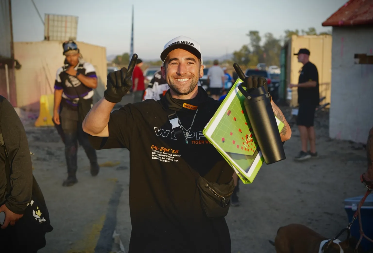 Kyle smiling with a tactics board in golden light