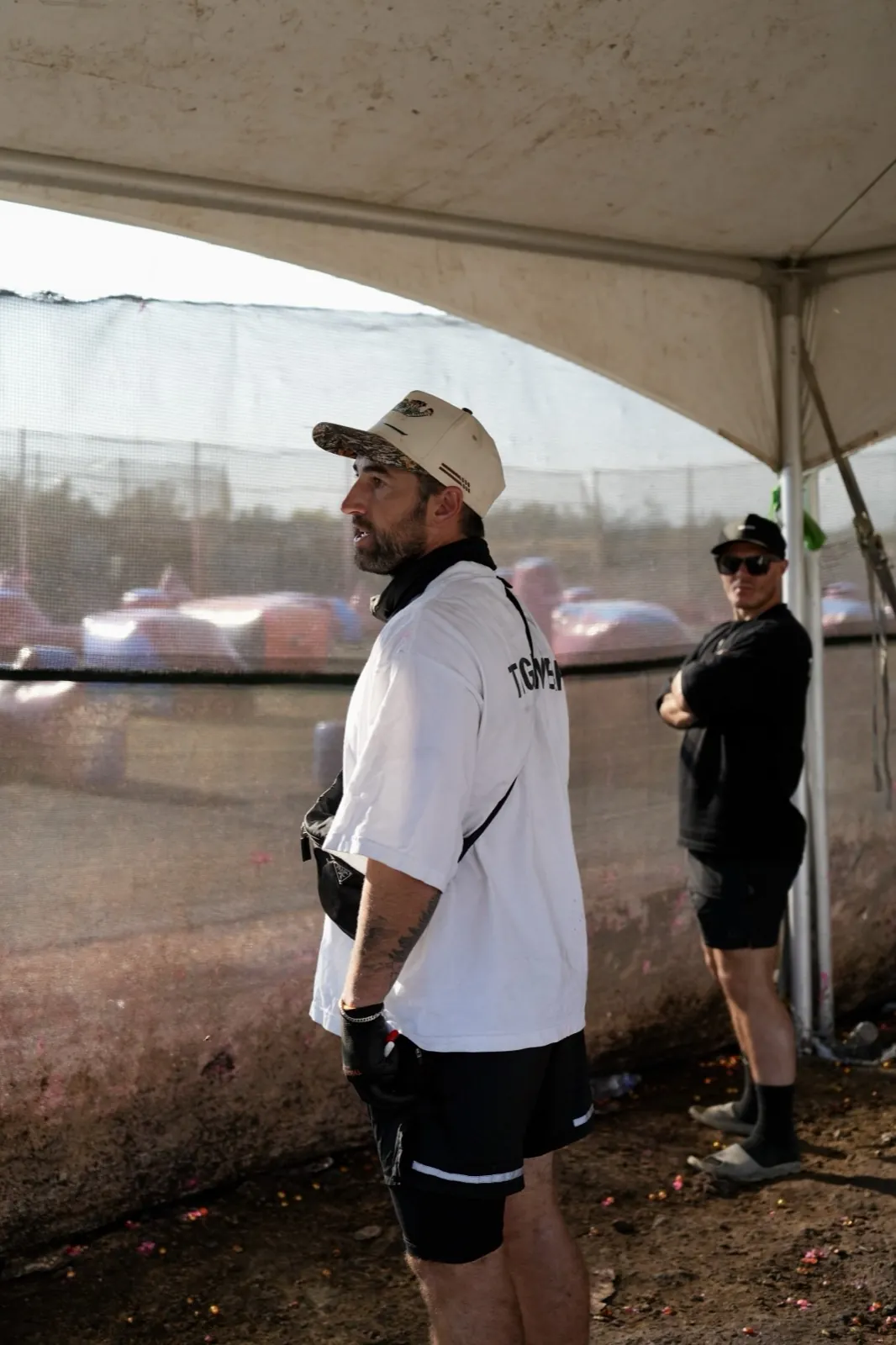 Kyle at the netting, calling the field from the pit