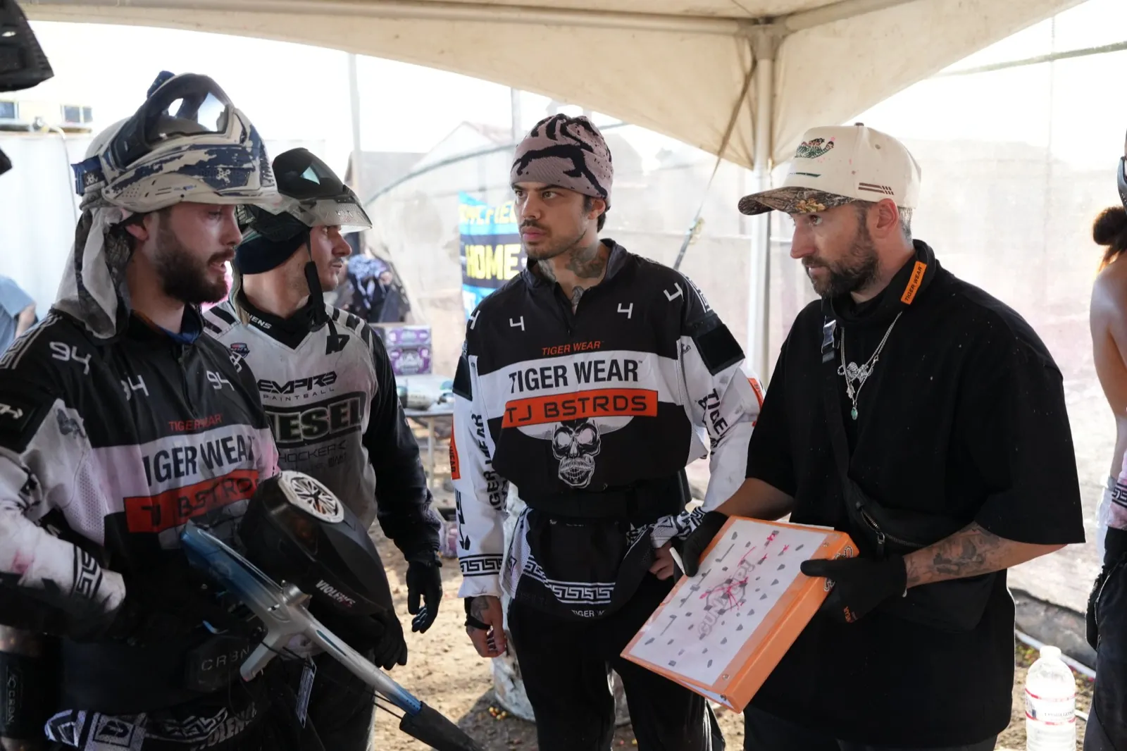 Kyle walking a team through a plan on a tactics board