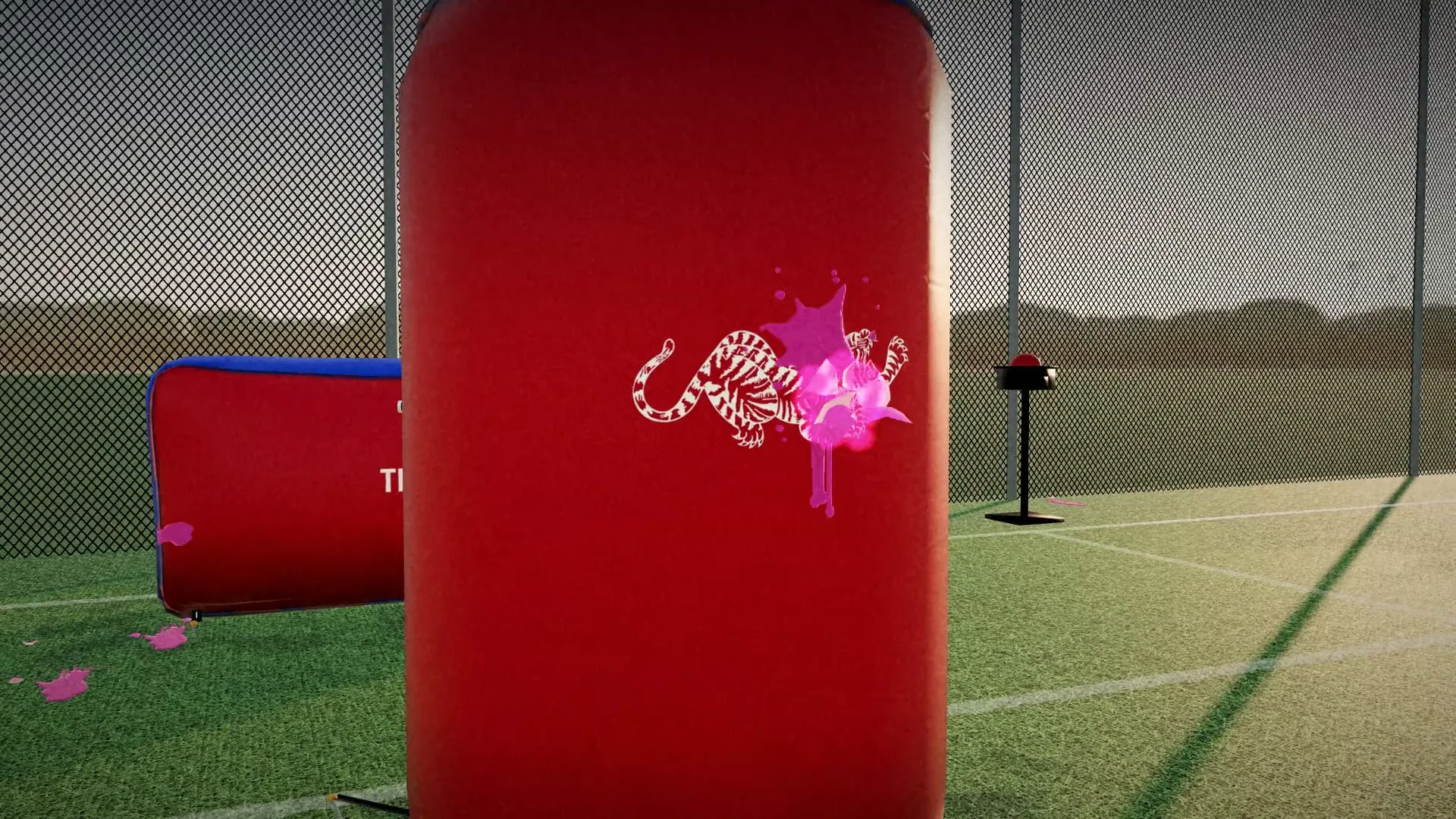 A pink paint splat on a red bunker with the tiger mark
