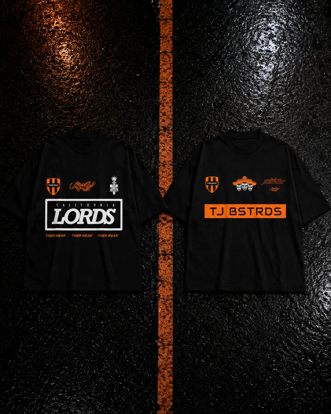 TJ Bastards x Tigerwear and Lords California x Tigerwear tees laid on asphalt beside an orange line
