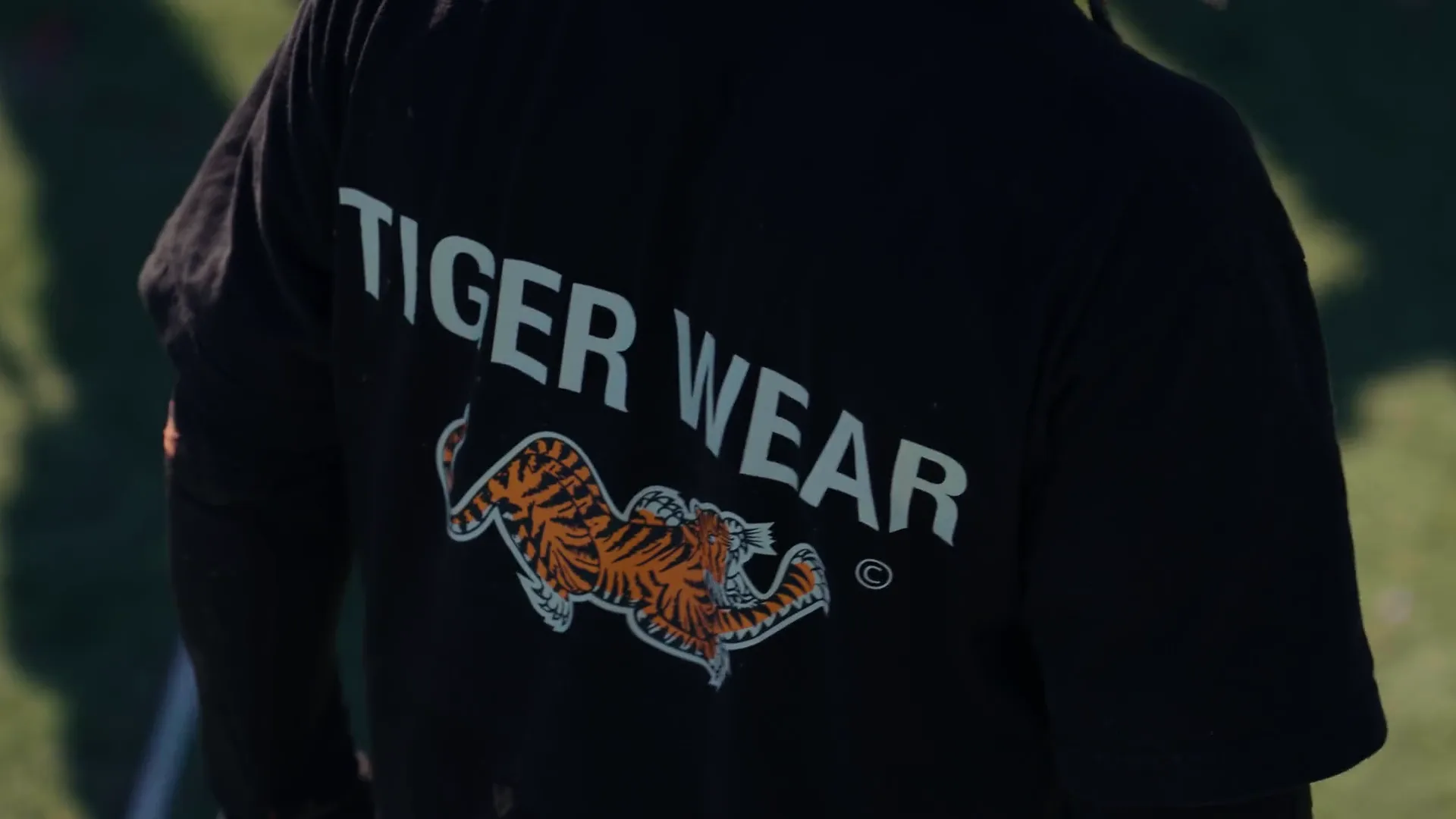 Slow motion shot of the Tiger Wear back print on a player at a bunker