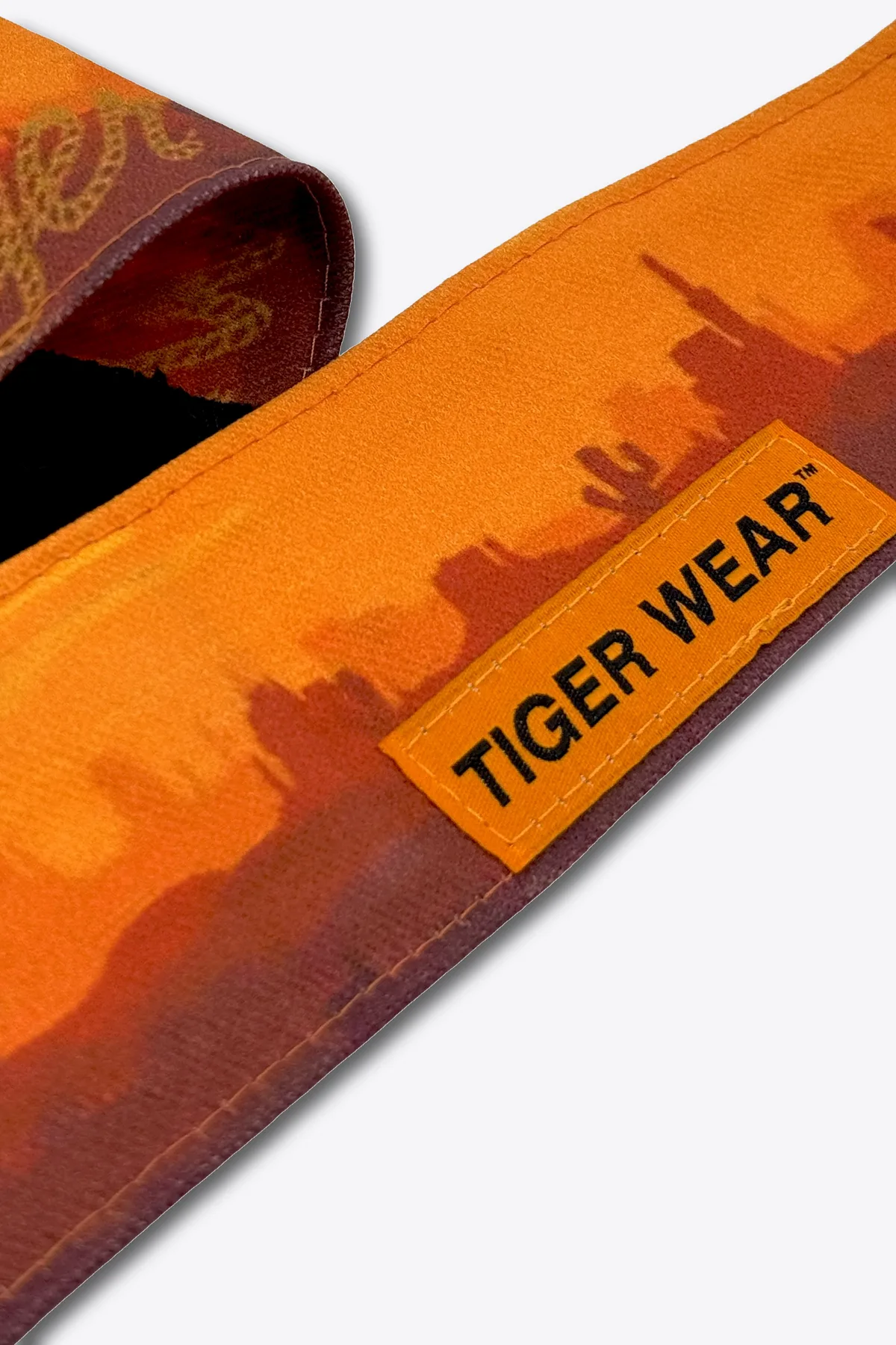 High Noon headband, orange desert sunset print with the Tiger Wear patch